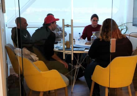ClickEat team members in a meeting room during a work discussion