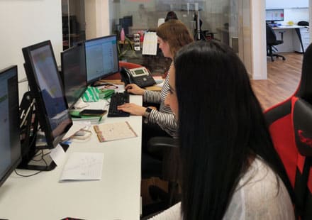 ClickEat team members working at desktop computers